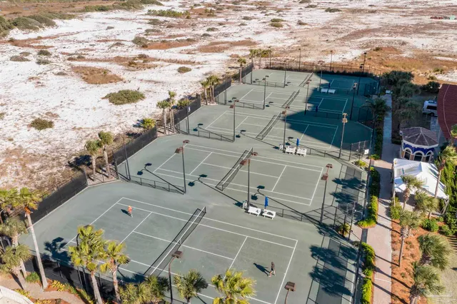 a view of a city street next to a building