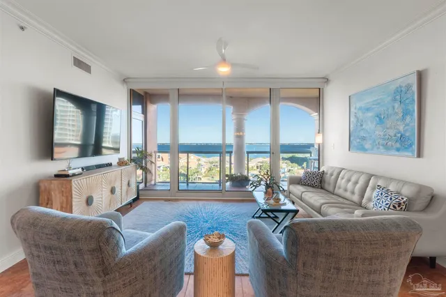 a living room with furniture and a flat screen tv