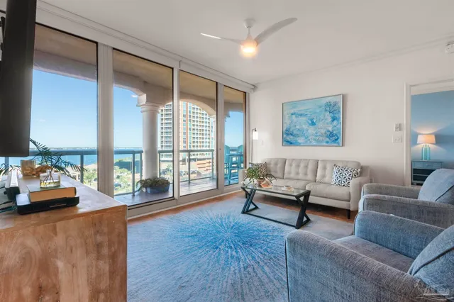 a living room with furniture and a large window
