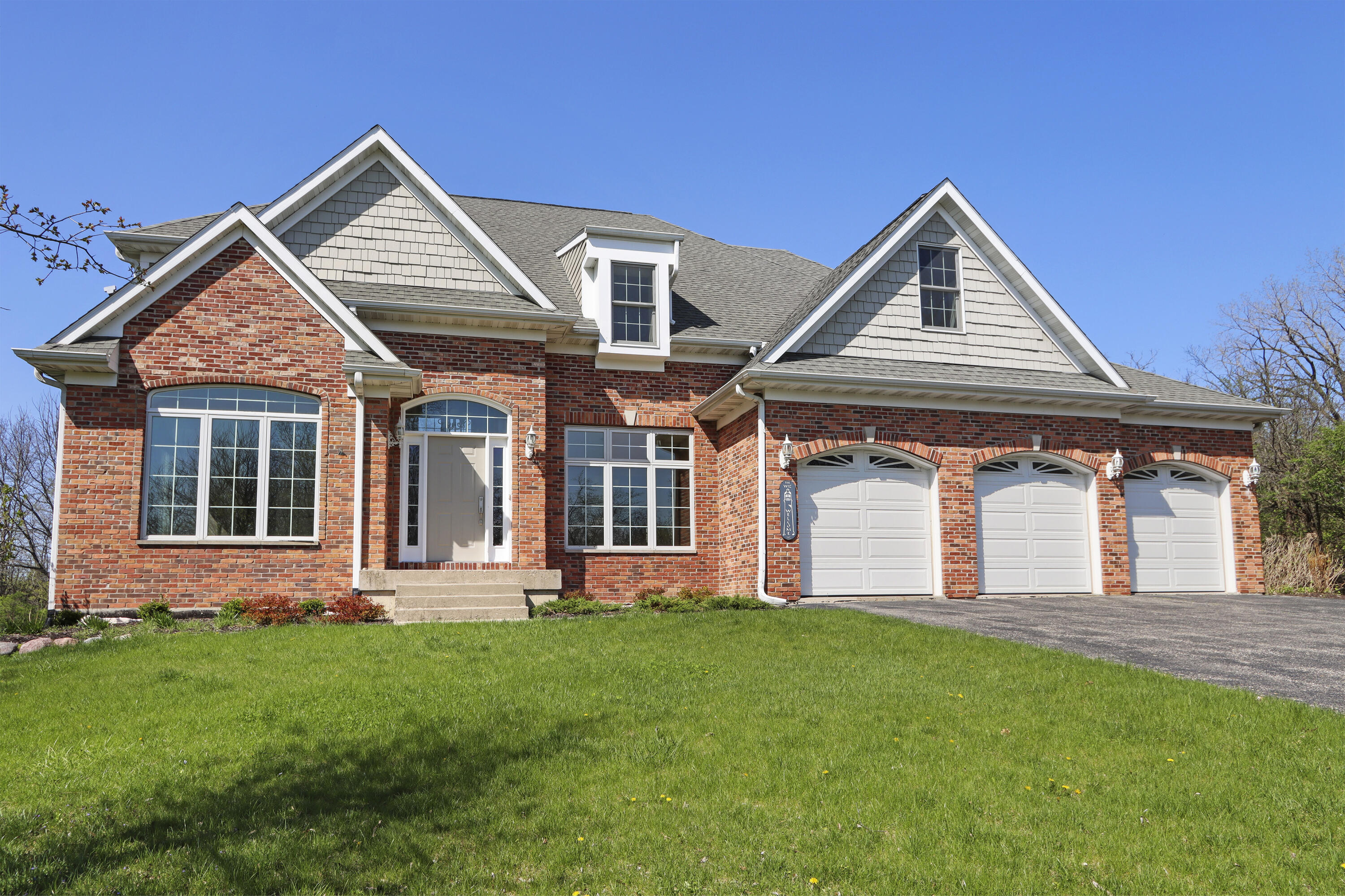 392 County Road B Fontana, WI 53125 - Photo 1 of 75 Luxury, Spaciousness, Natural Beauty, Convenience and Lake Rights all await you at this wonderful Country Club Estates home!