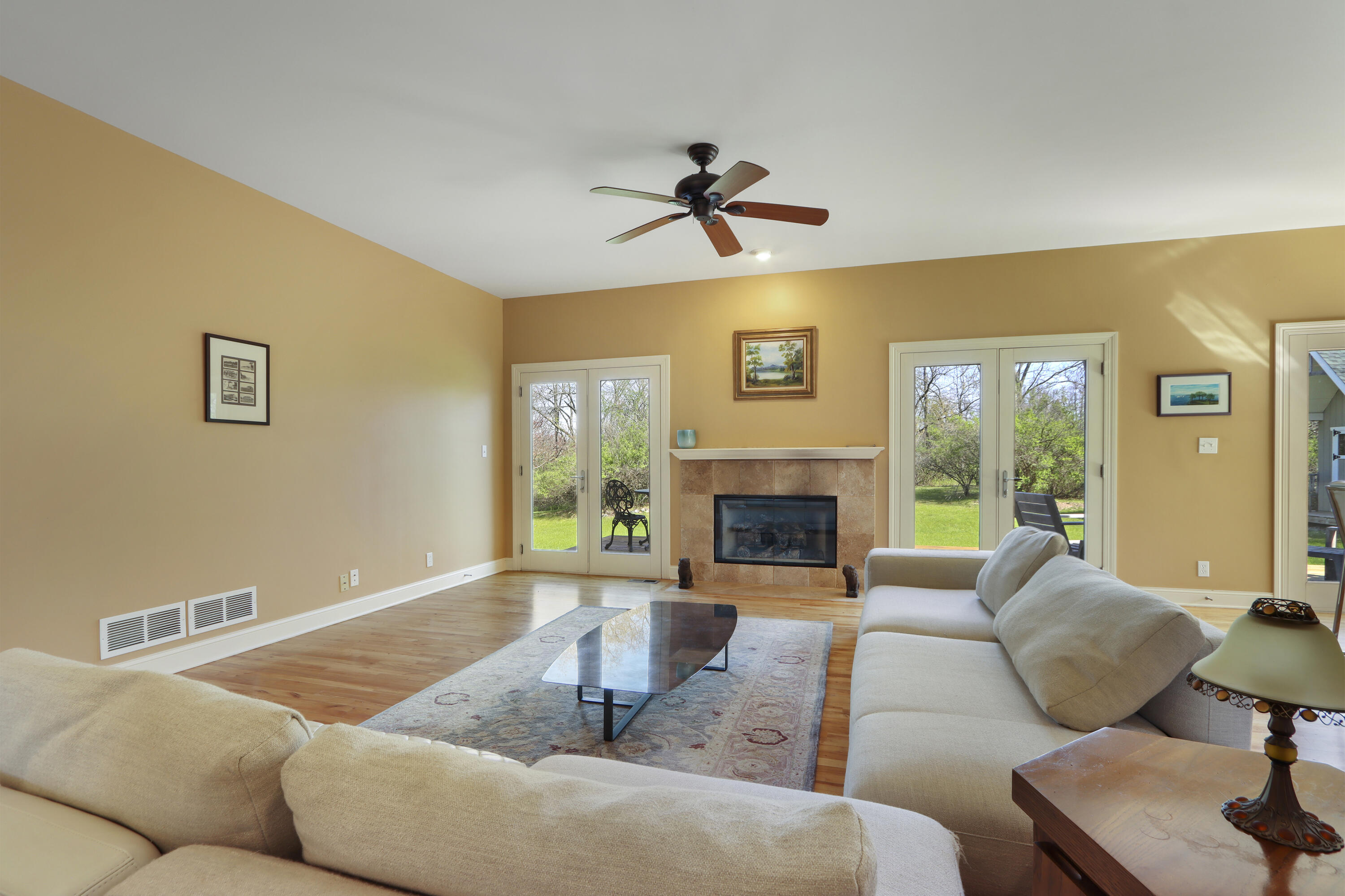 392 County Road B Fontana, WI 53125 - Photo 11 of 75 The expansive Great Room has double doors to the deck and wood floors