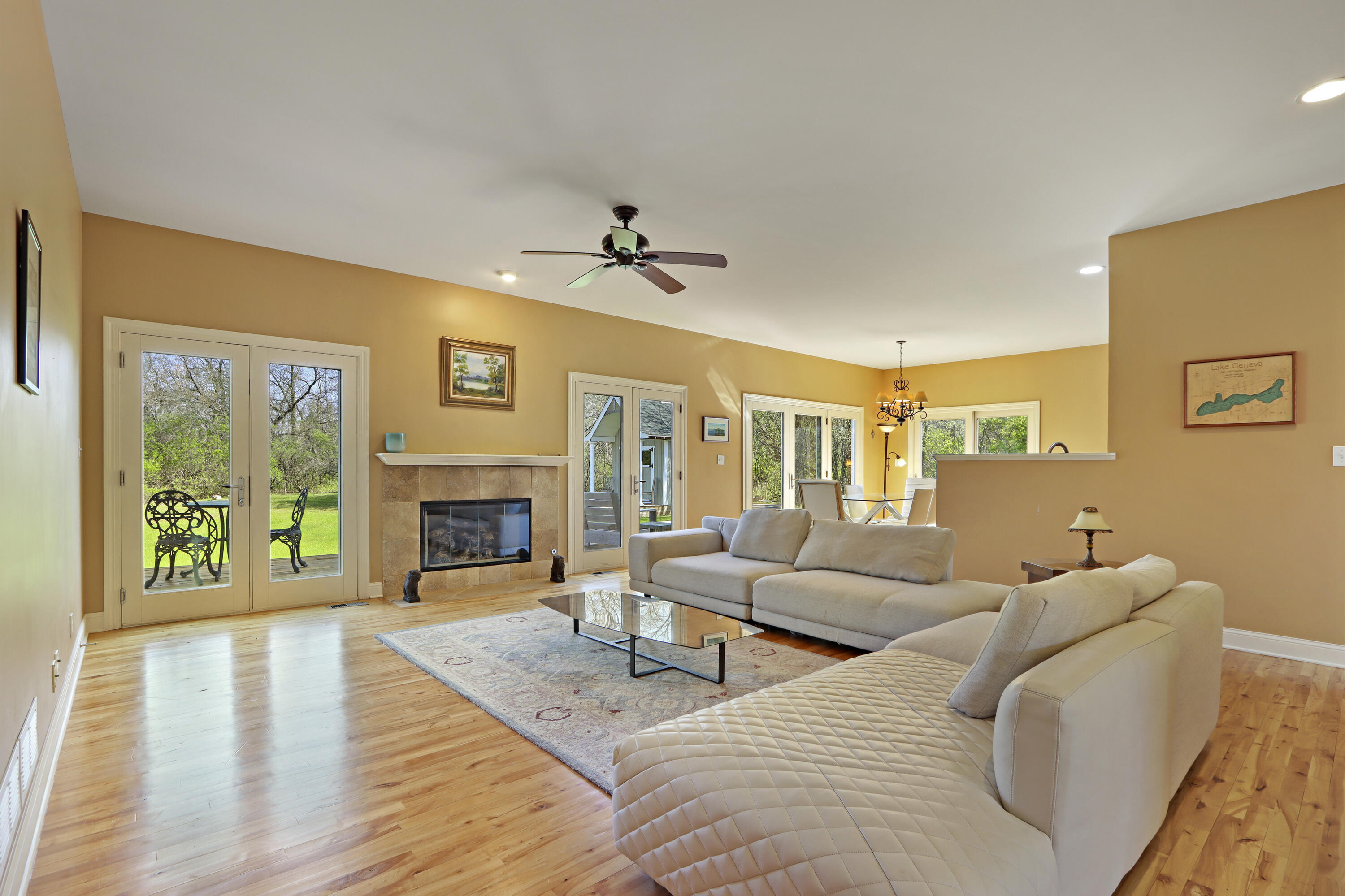 392 County Road B Fontana, WI 53125 - Photo 13 of 75 The wall of glass doors across the Great Room and Dinette bring the sunlight and natural beauty of the setting in to the home