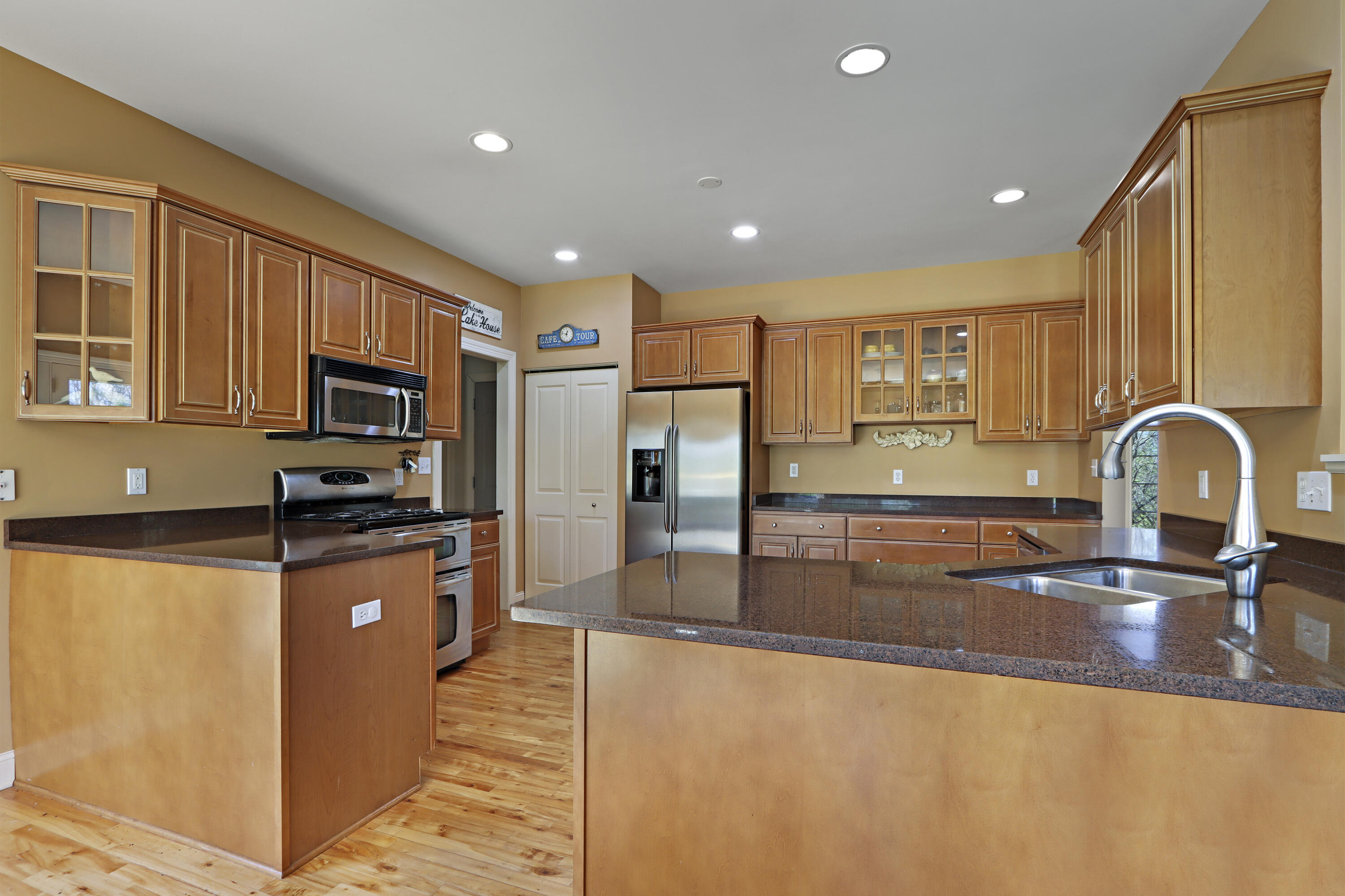 392 County Road B Fontana, WI 53125 - Photo 17 of 75 The kitchen has plenty of countertop and cabinet space and a breakfast bar and is a joy to cook and entertain in