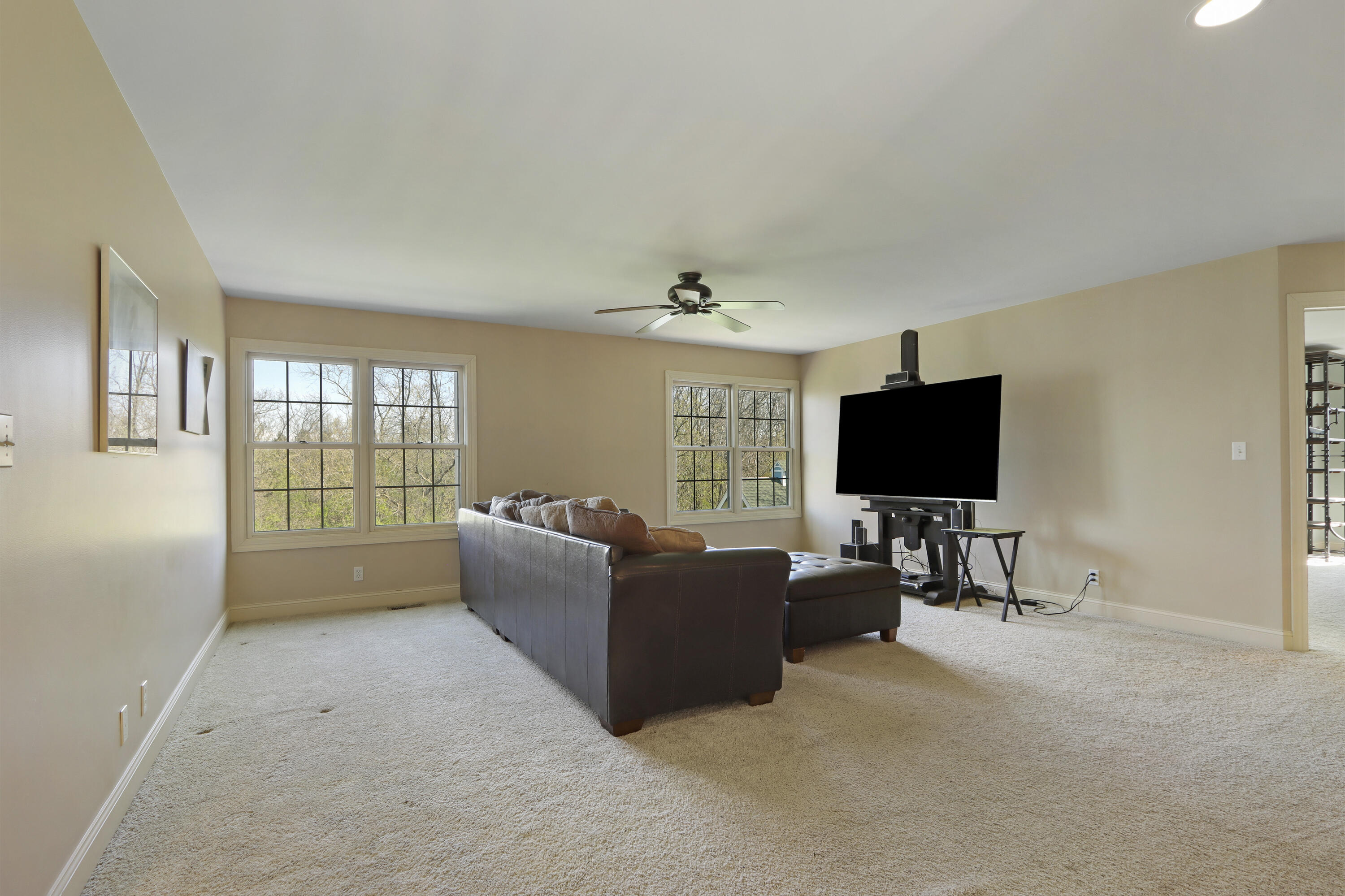392 County Road B Fontana, WI 53125 - Photo 25 of 75 Wow! What a bonus! This supersized Family Room on the UL has room for everyone to gather for movies or sporting events or video gaming