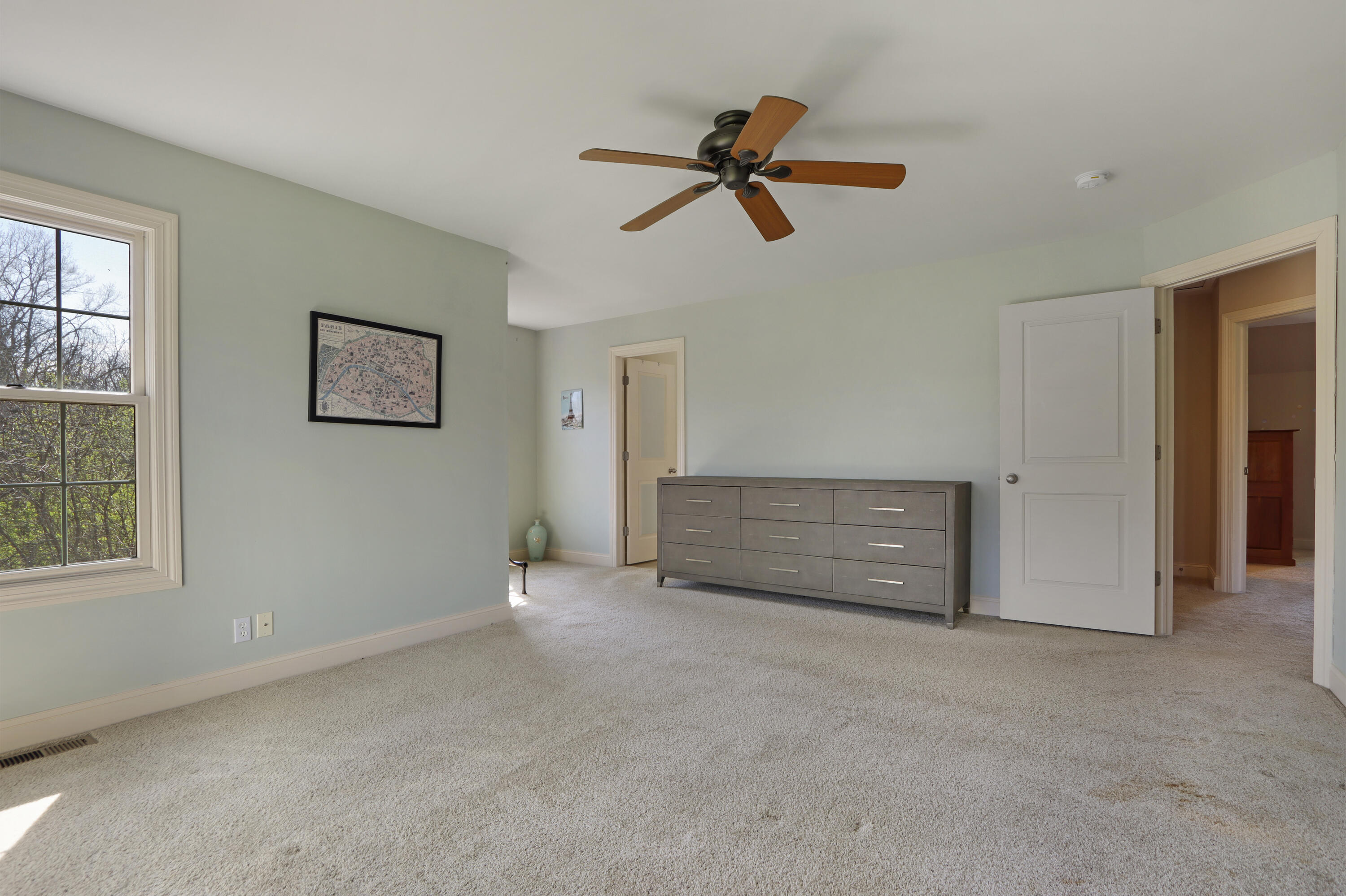392 County Road B Fontana, WI 53125 - Photo 28 of 75 The Primary Suite has eastern and northern views and is large enough for all of your favorite bedroom furniture