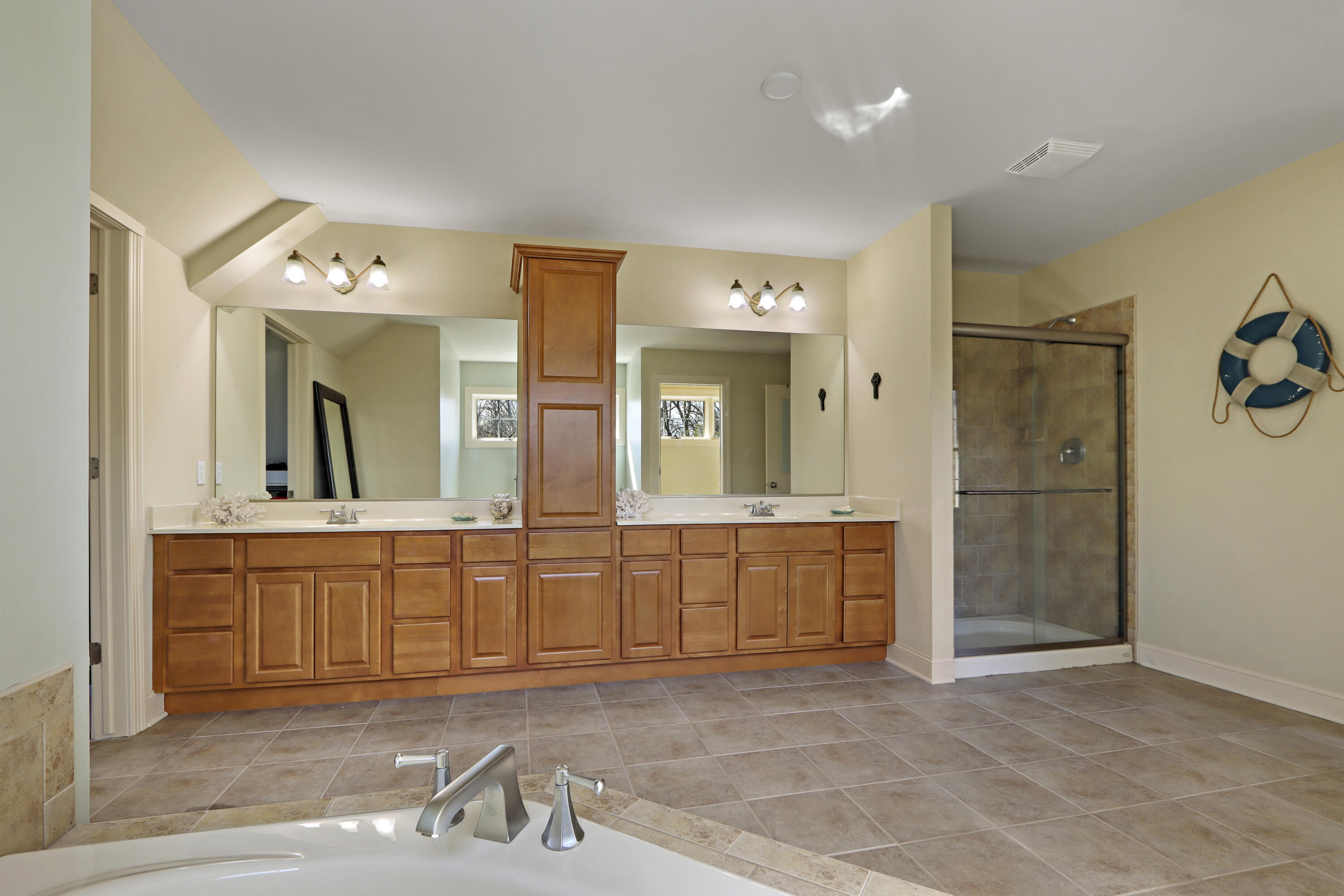 392 County Road B Fontana, WI 53125 - Photo 31 of 75 No need to worry about sharing...the oversized double sink vanity has plenty of space and is divided by a tower