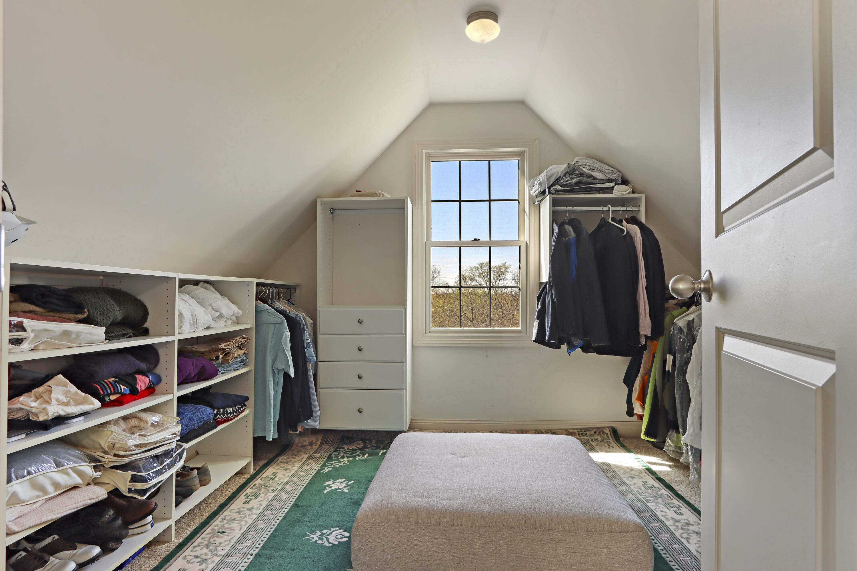 392 County Road B Fontana, WI 53125 - Photo 33 of 75 The large walk-in closet has a southern facing window and clipped cathedral ceiling