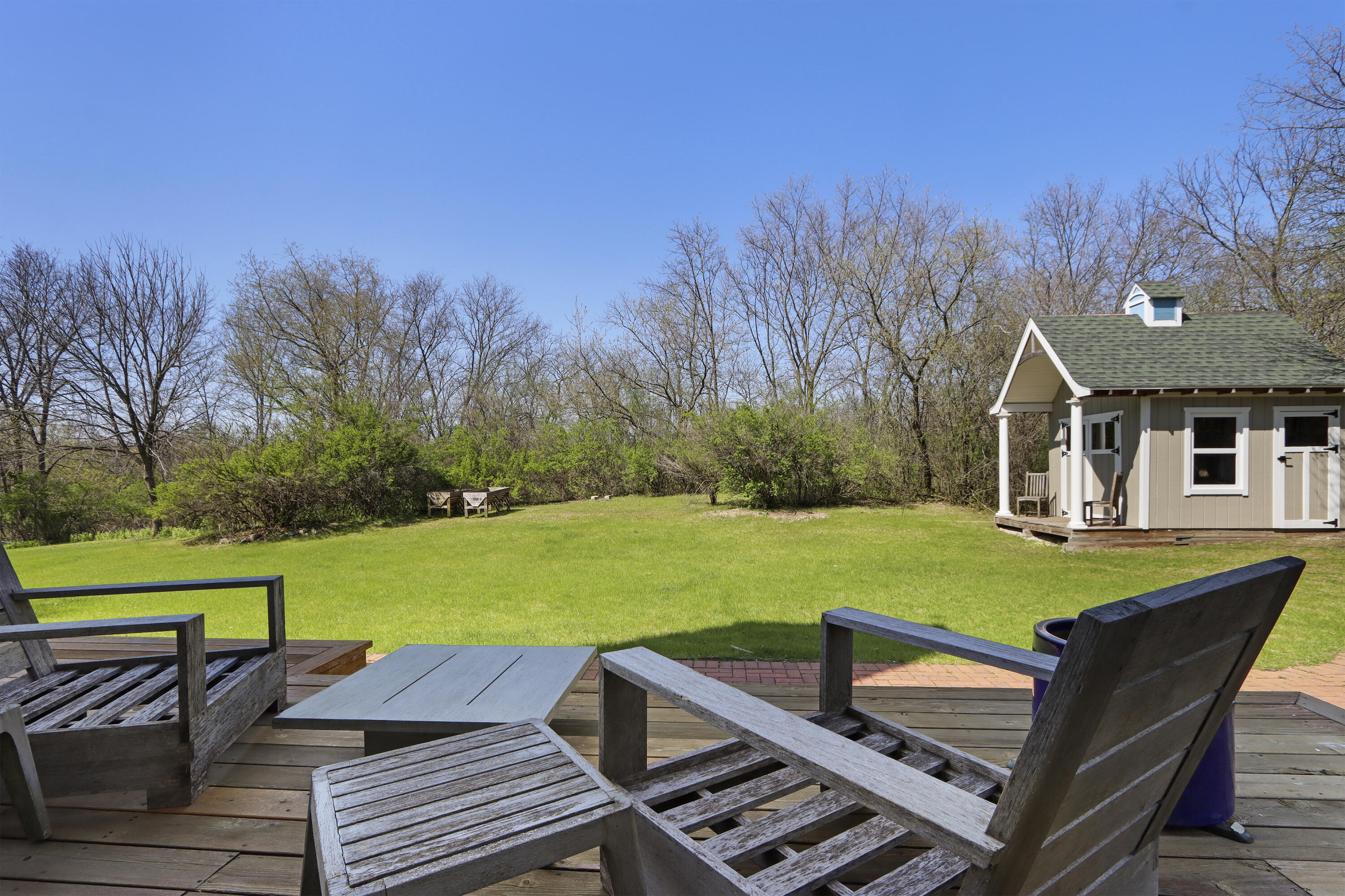 392 County Road B Fontana, WI 53125 - Photo 47 of 75 The huge deck has room for multiple seating and dining furniture groups