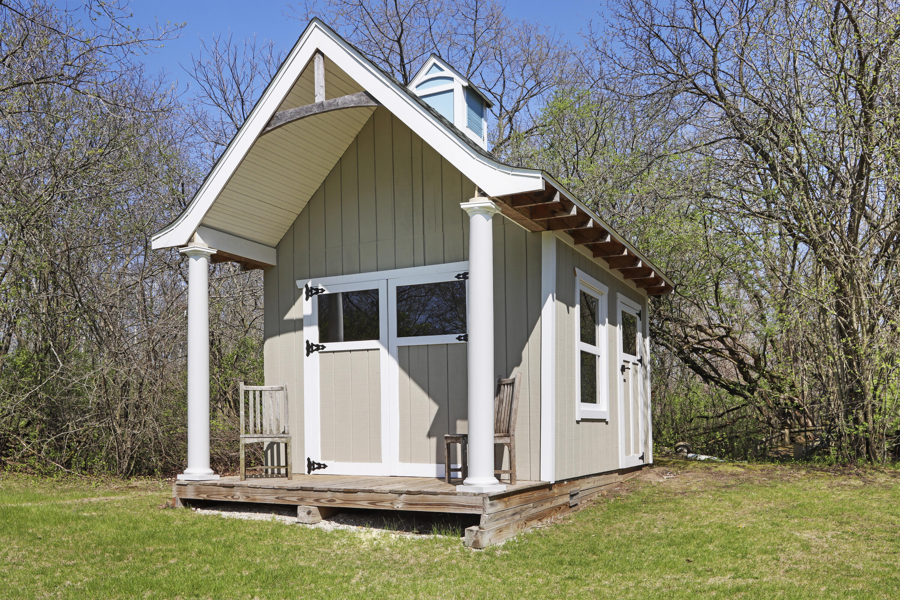 392 County Road B Fontana, WI 53125 - Photo 50 of 75 This awesome entertainment shed has a covered front porch, 2 sets of doors and could be a garden shed, storage shed, "She Shed", party/bar shed or pet cottage.