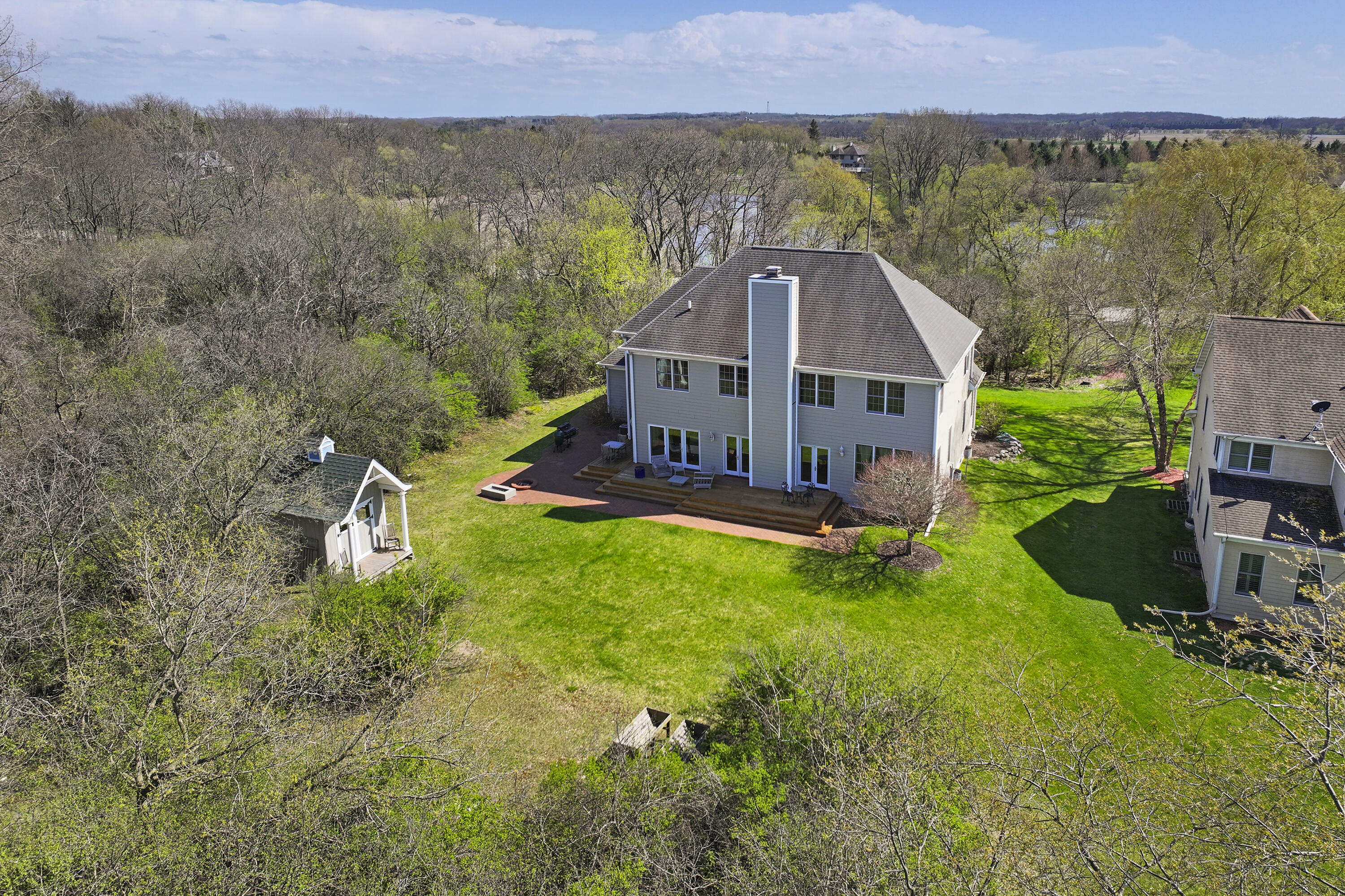 392 County Road B Fontana, WI 53125 - Photo 53 of 75 The back yard has plenty of open space and room for fun and entertaining