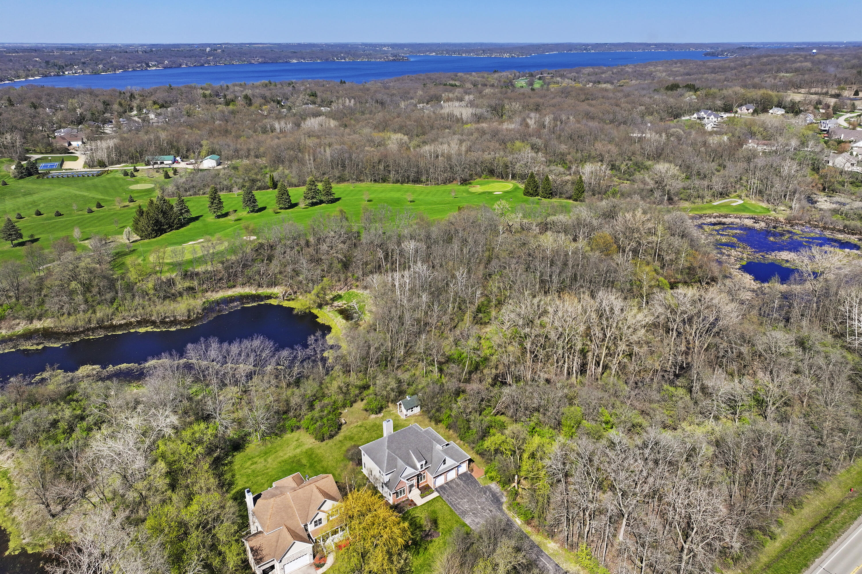 392 County Road B Fontana, WI 53125 - Photo 55 of 75 This home is nestled in to an incredible natural setting surrounded by several ponds with the Conservancy woodlands and their walking trails on the northern border that open on to the CCE golf course with Geneva Lake just beyond down Shabbona Drive
