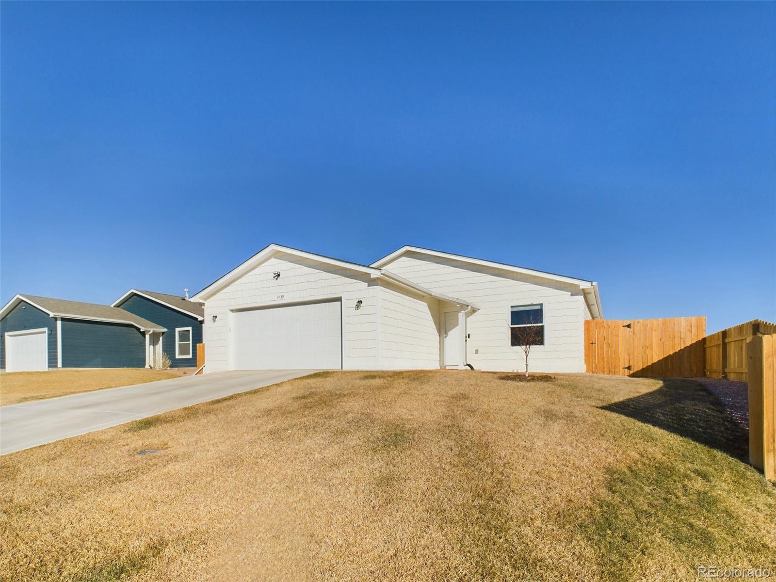 a view of house with yard
