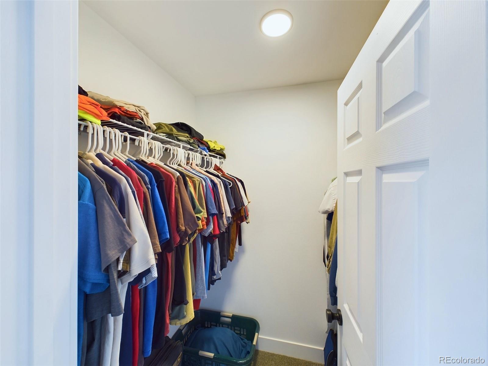 1439 Brewery Road Pueblo, CO 81001 - Photo 12 of 25 a view of walk in closet with clothes and shoes