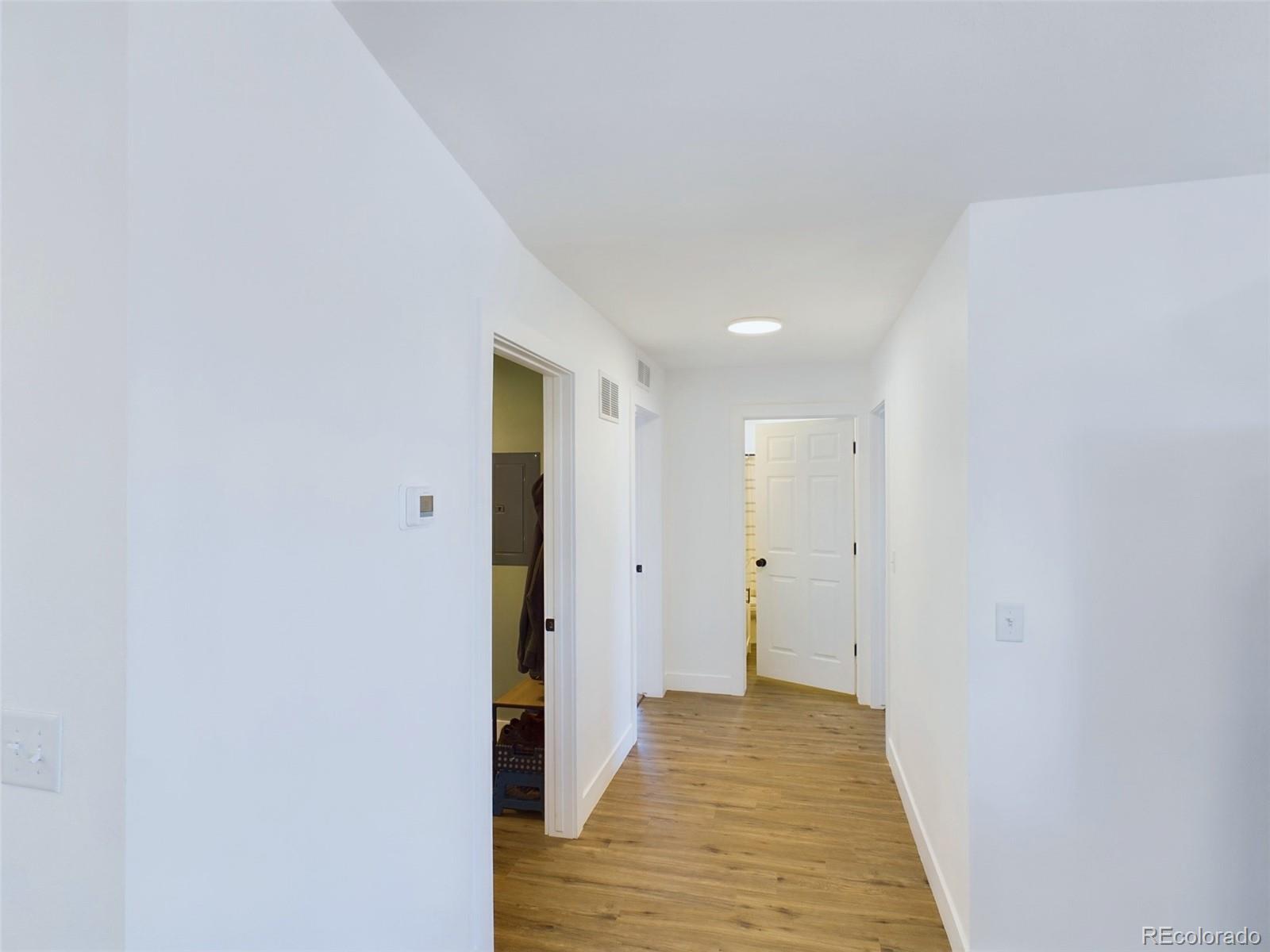 1439 Brewery Road Pueblo, CO 81001 - Photo 15 of 25 a view of a hallway with wooden floor
