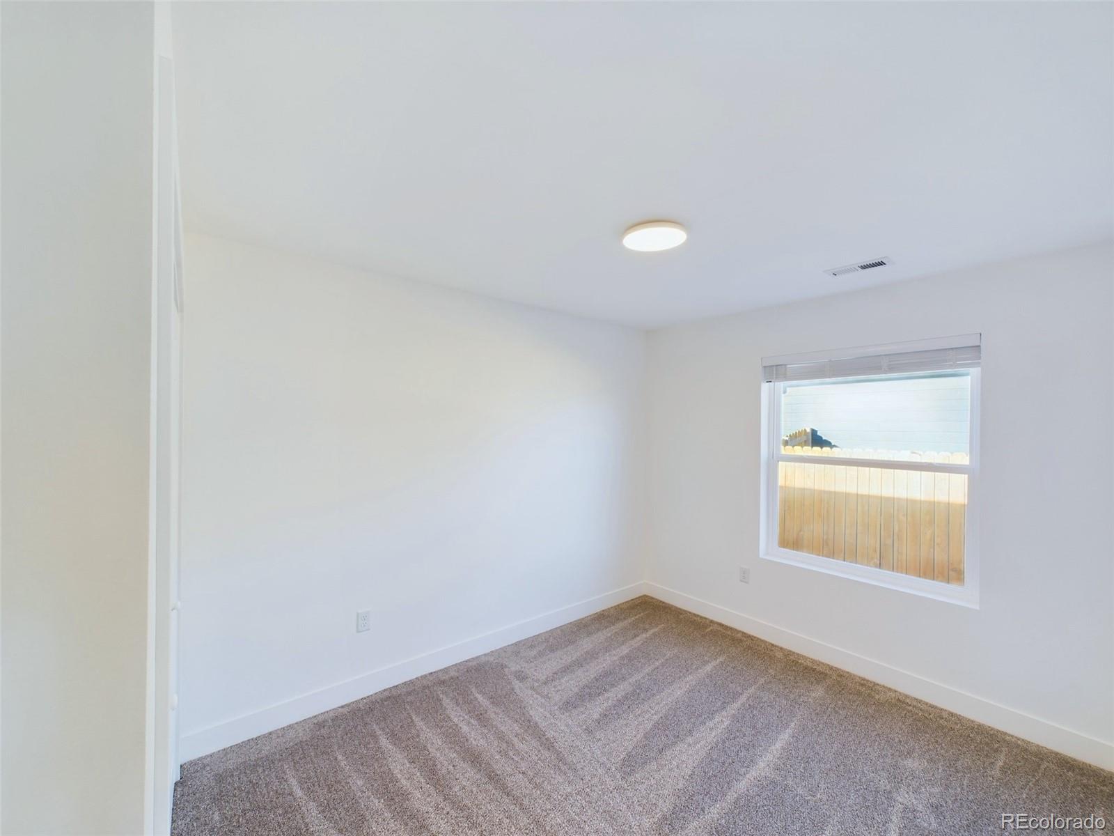 1439 Brewery Road Pueblo, CO 81001 - Photo 16 of 25 a view of an empty room and window