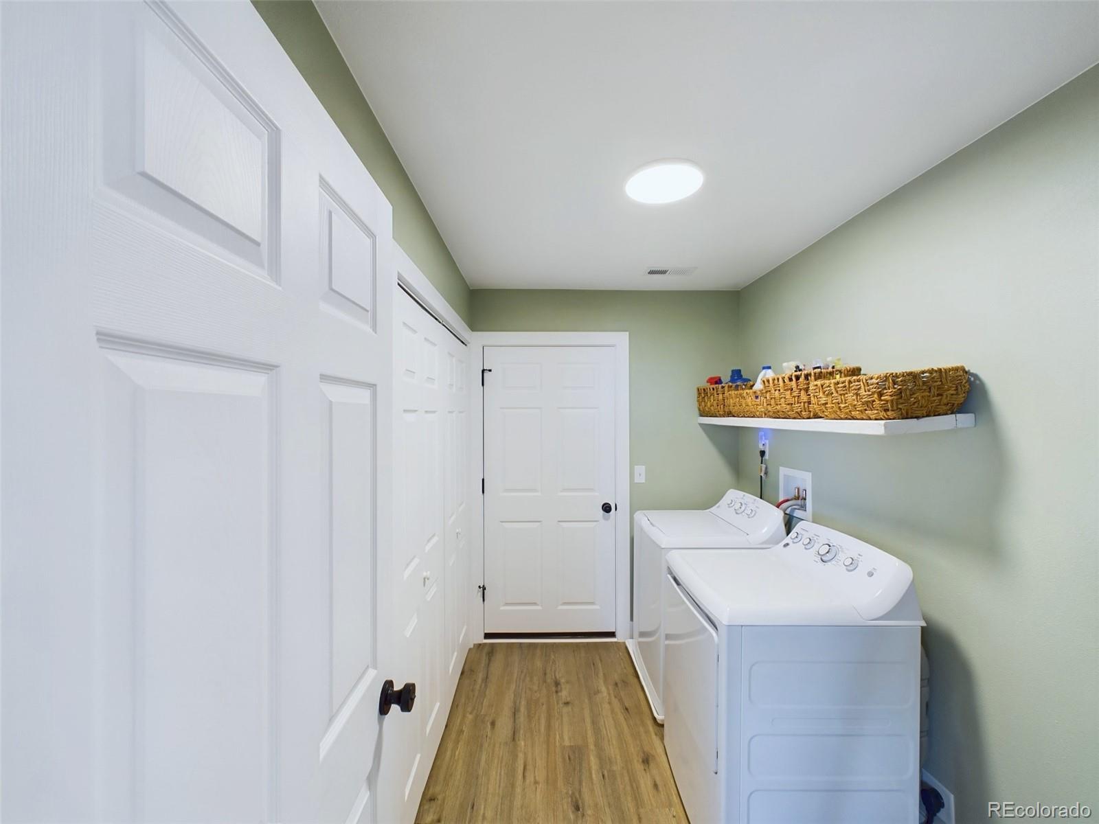 1439 Brewery Road Pueblo, CO 81001 - Photo 19 of 25 a hallway with washer and dryer