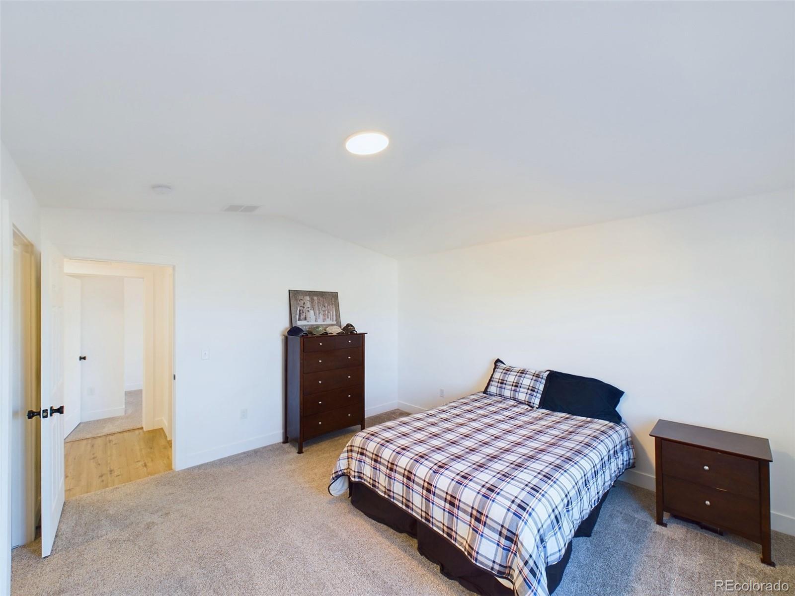 1439 Brewery Road Pueblo, CO 81001 - Photo 9 of 25 a bedroom with a bed and a closet