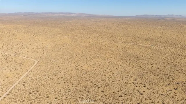 a view of an empty room with mountain