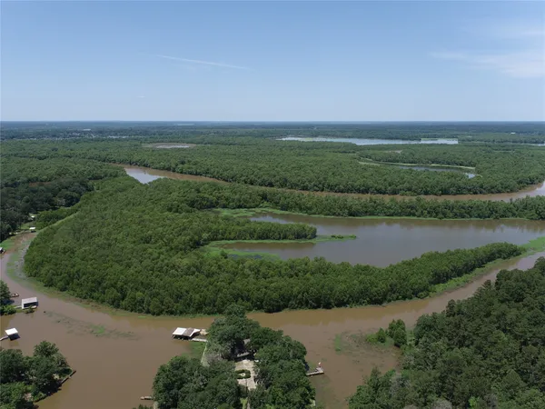 an aerial view of a houses with lake view