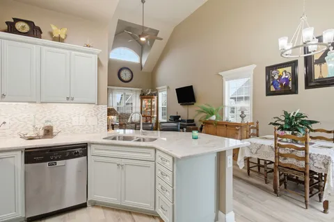 a kitchen with a refrigerator and sink