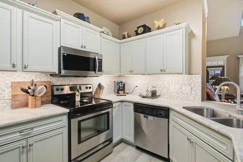 a view of a dining room with furniture wooden floor and a window