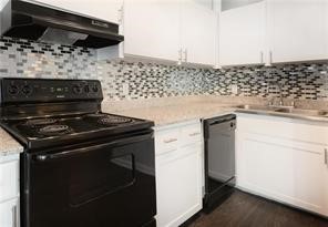2900 Cole Street, Unit 307 Austin, TX 78705 - Photo 13 of 20 a stove top oven sitting inside of a kitchen