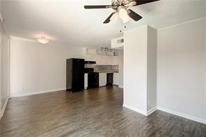 2900 Cole Street, Unit 307 Austin, TX 78705 - Photo 5 of 20 a view of a kitchen with a sink and a refrigerator