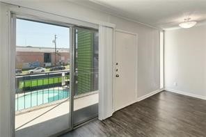 2900 Cole Street, Unit 307 Austin, TX 78705 - Photo 8 of 20 a view of a room with wooden floor and windows