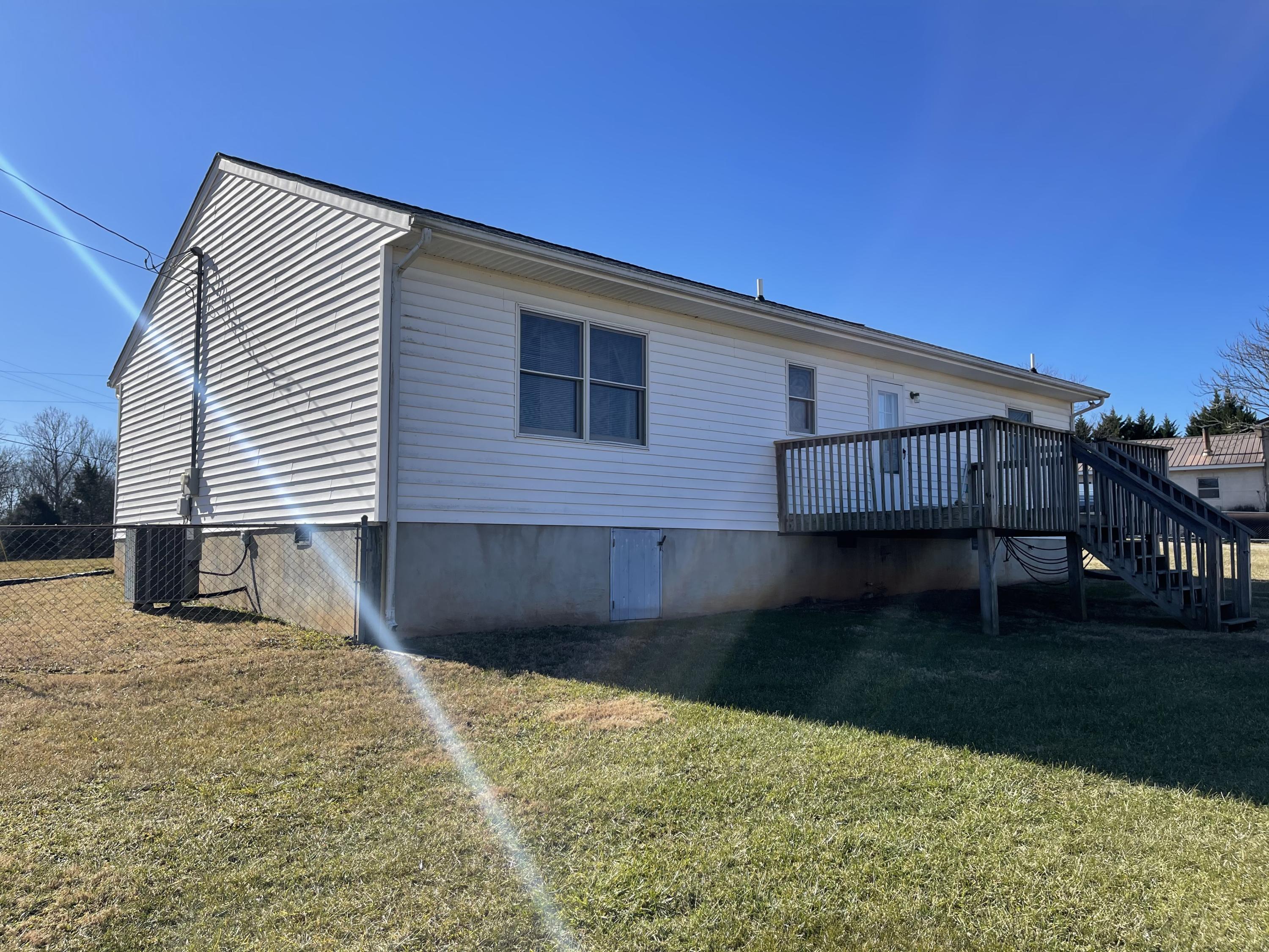 680 Callaway Road Rocky Mount, VA 24151 - Photo 8 of 12 a view of a house with backyard and trees