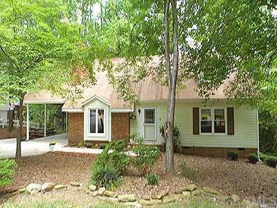 6232 Rushingbrook Drive Raleigh, NC 27612 - Photo 1 of 1 front view of a house with a tree