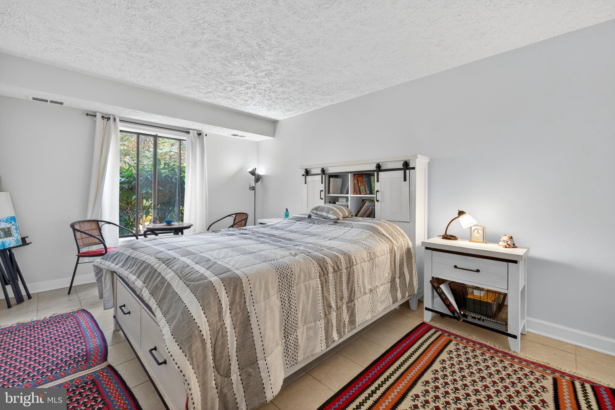 910 Windbrooke Drive, Unit 910 Gaithersburg, MD 20879 - Photo 14 of 20 Serene bedroom with natural light and charm.