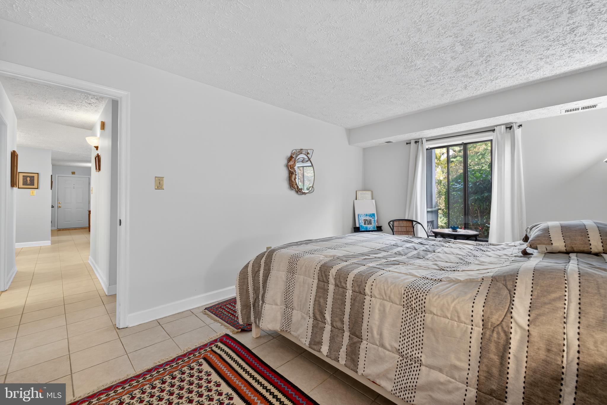 910 Windbrooke Drive, Unit 910 Gaithersburg, MD 20879 - Photo 15 of 20 Serene bedroom with natural light and charm.