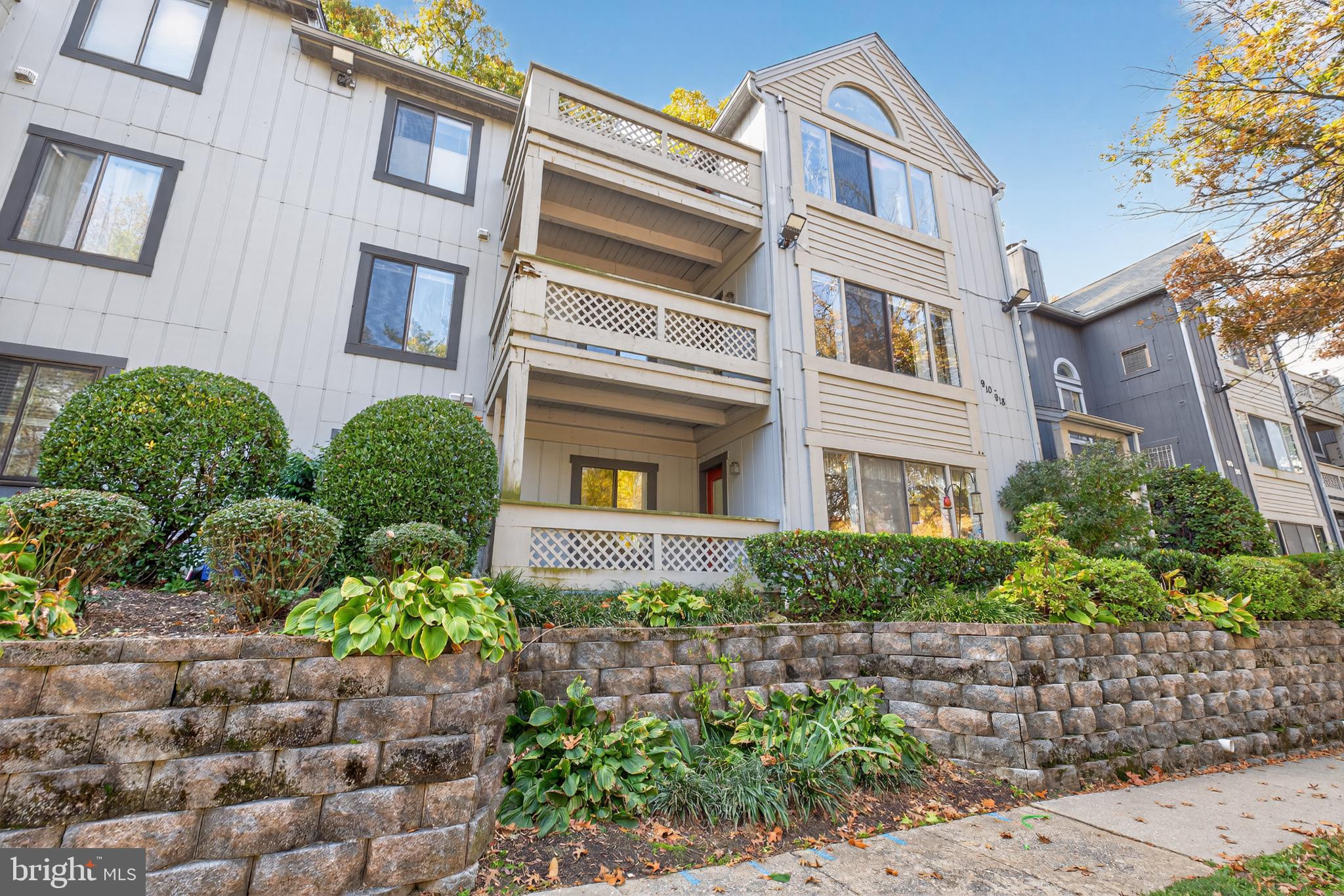 910 Windbrooke Drive, Unit 910 Gaithersburg, MD 20879 - Photo 4 of 20 Charming multi-level residence with lush greenery.