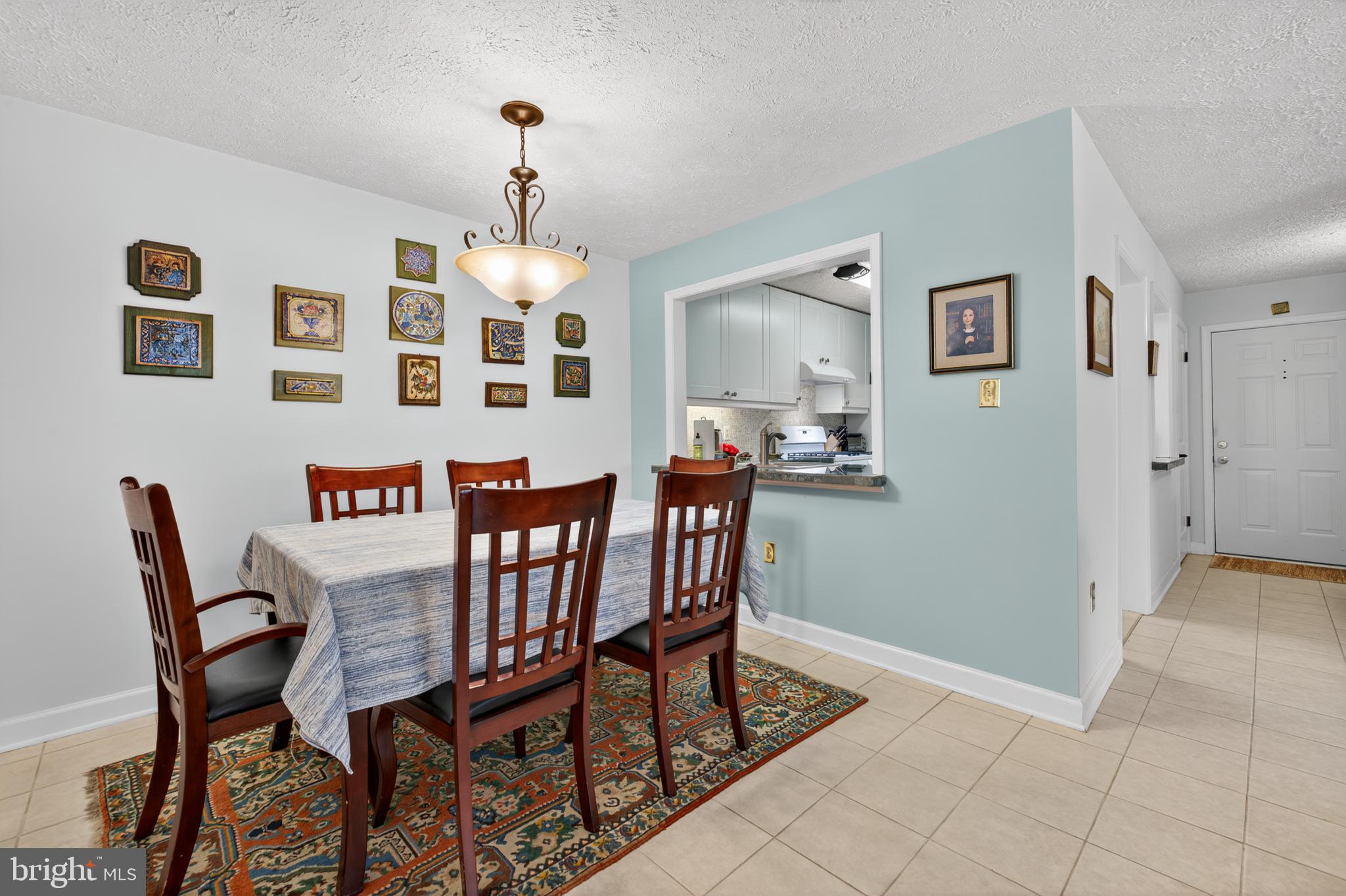 910 Windbrooke Drive, Unit 910 Gaithersburg, MD 20879 - Photo 9 of 20 Charming dining area with artistic flair.