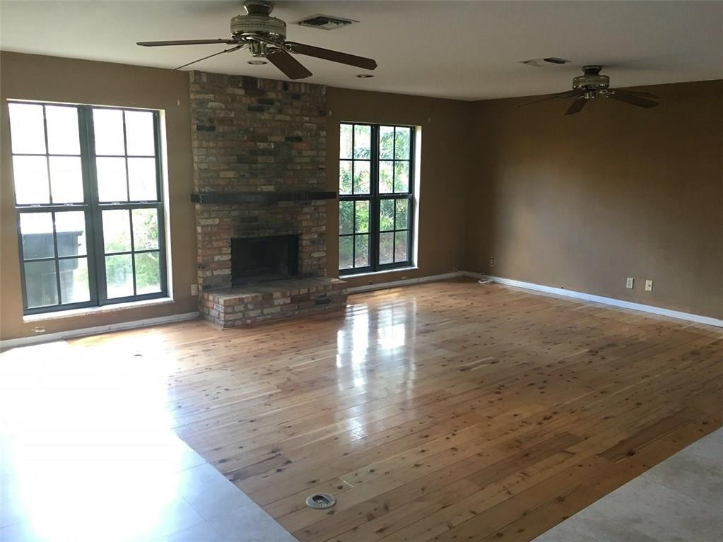 1498 Southwest 19th Street Boca Raton, FL 33486 - Photo 6 of 13 wooden floor in an empty room with a window