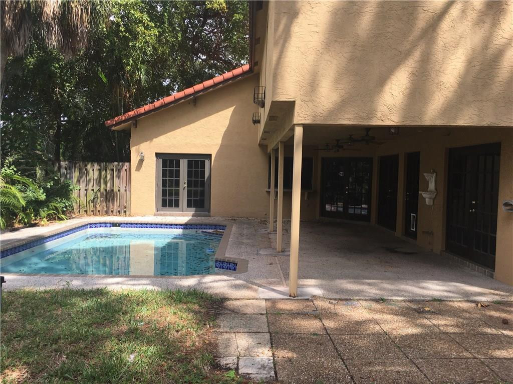 1498 Southwest 19th Street Boca Raton, FL 33486 - Photo 9 of 13 a view of a house with backyard porch and sitting area