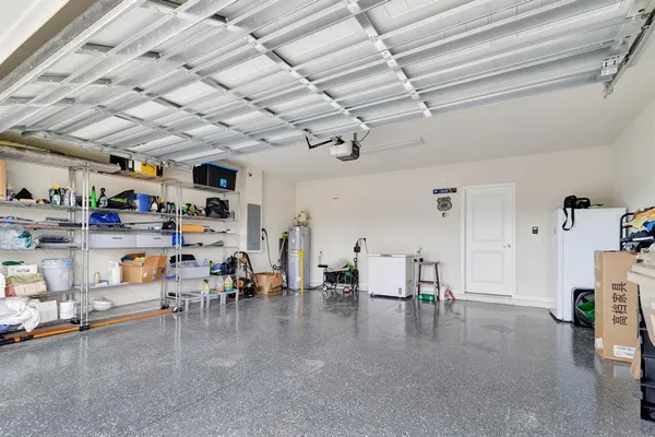 a living room with lots of furniture and a chandelier