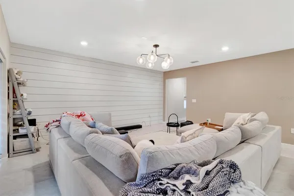 a bedroom with furniture and white walls
