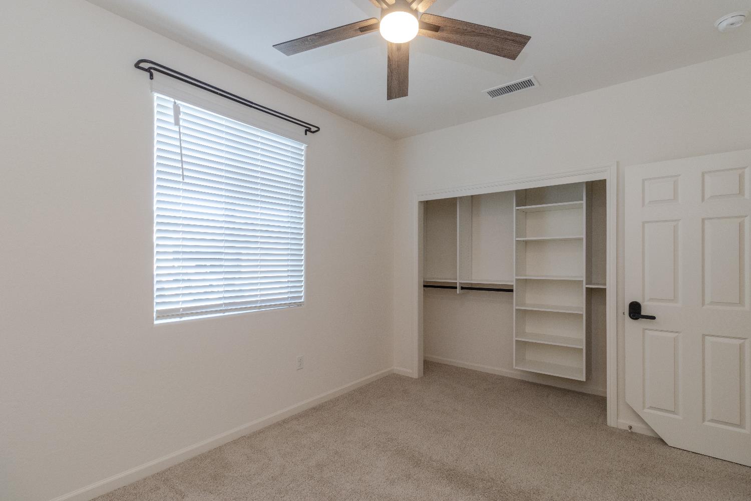 1158 Encore Way West Madera, CA 93636 - Photo 20 of 45 a view of an empty room with a window