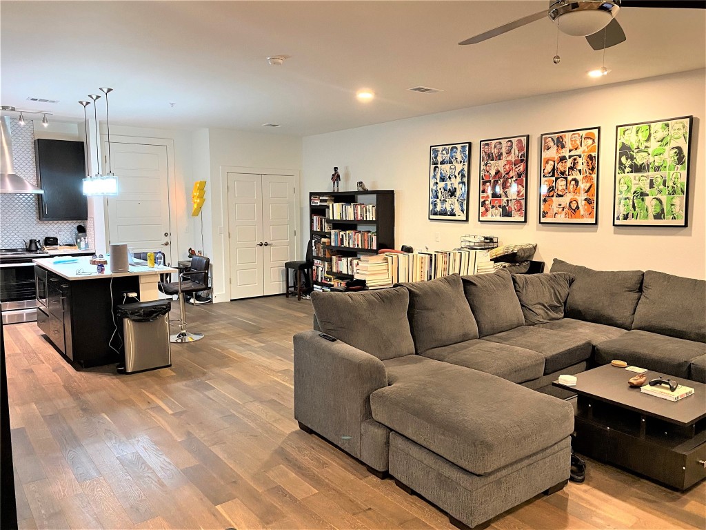 1615 East 7th Street, Unit 304 Austin, TX 78702 - Photo 1 of 12 a living room with furniture and a large window