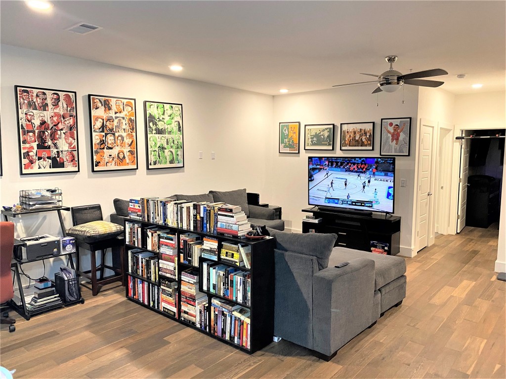 1615 East 7th Street, Unit 304 Austin, TX 78702 - Photo 3 of 12 a living room with furniture and a flat screen tv
