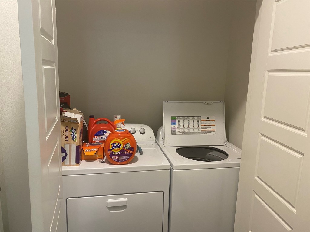 1615 East 7th Street, Unit 304 Austin, TX 78702 - Photo 8 of 12 a utility room with dryer and washer