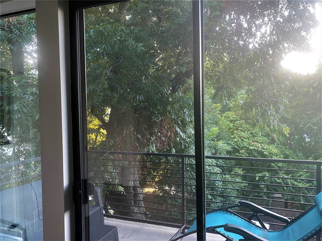 1615 East 7th Street, Unit 304 Austin, TX 78702 - Photo 9 of 12 a view of a glass door and porch