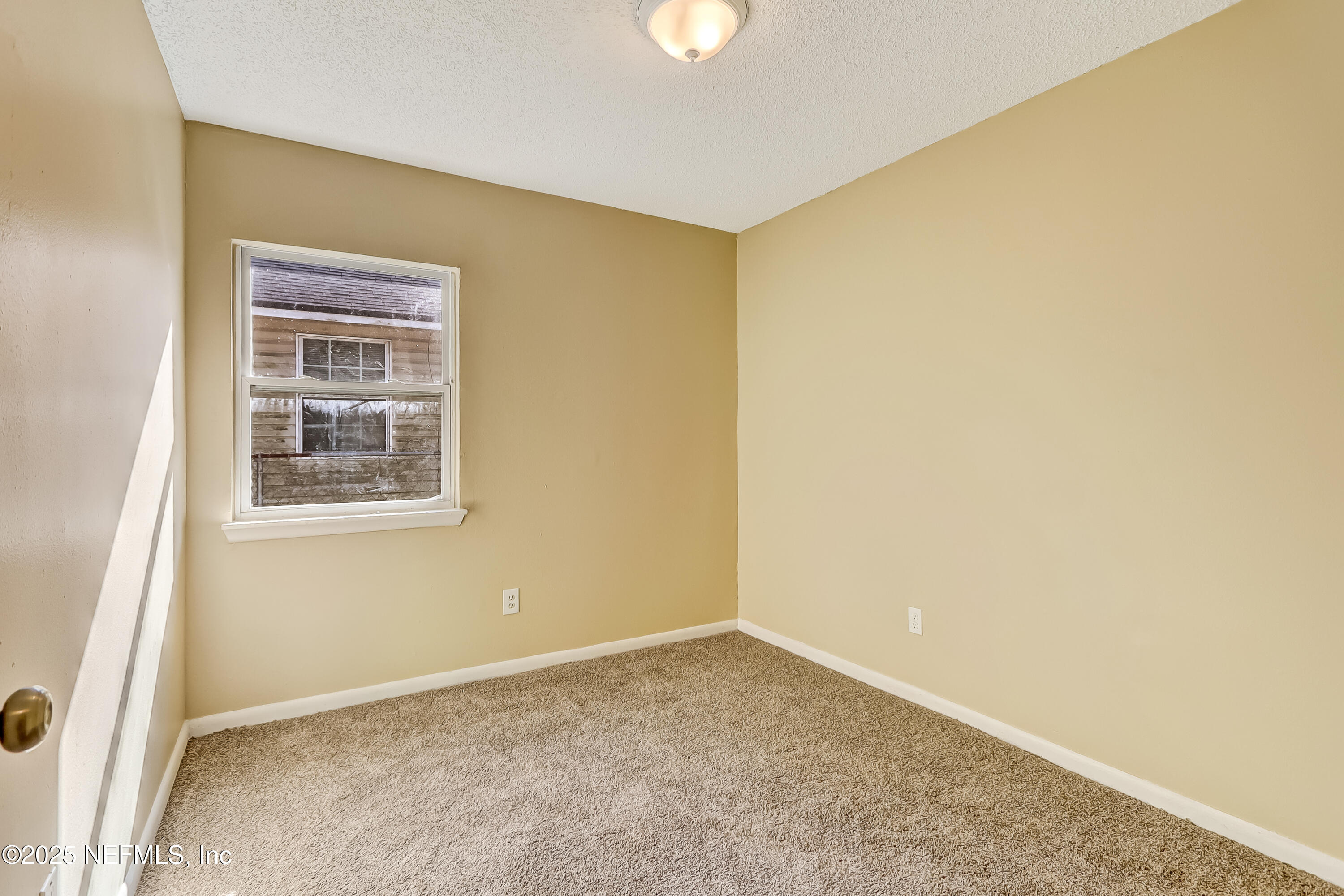 357 Smith Street Jacksonville, FL 32204 - Photo 14 of 26 a view of an empty room with a window