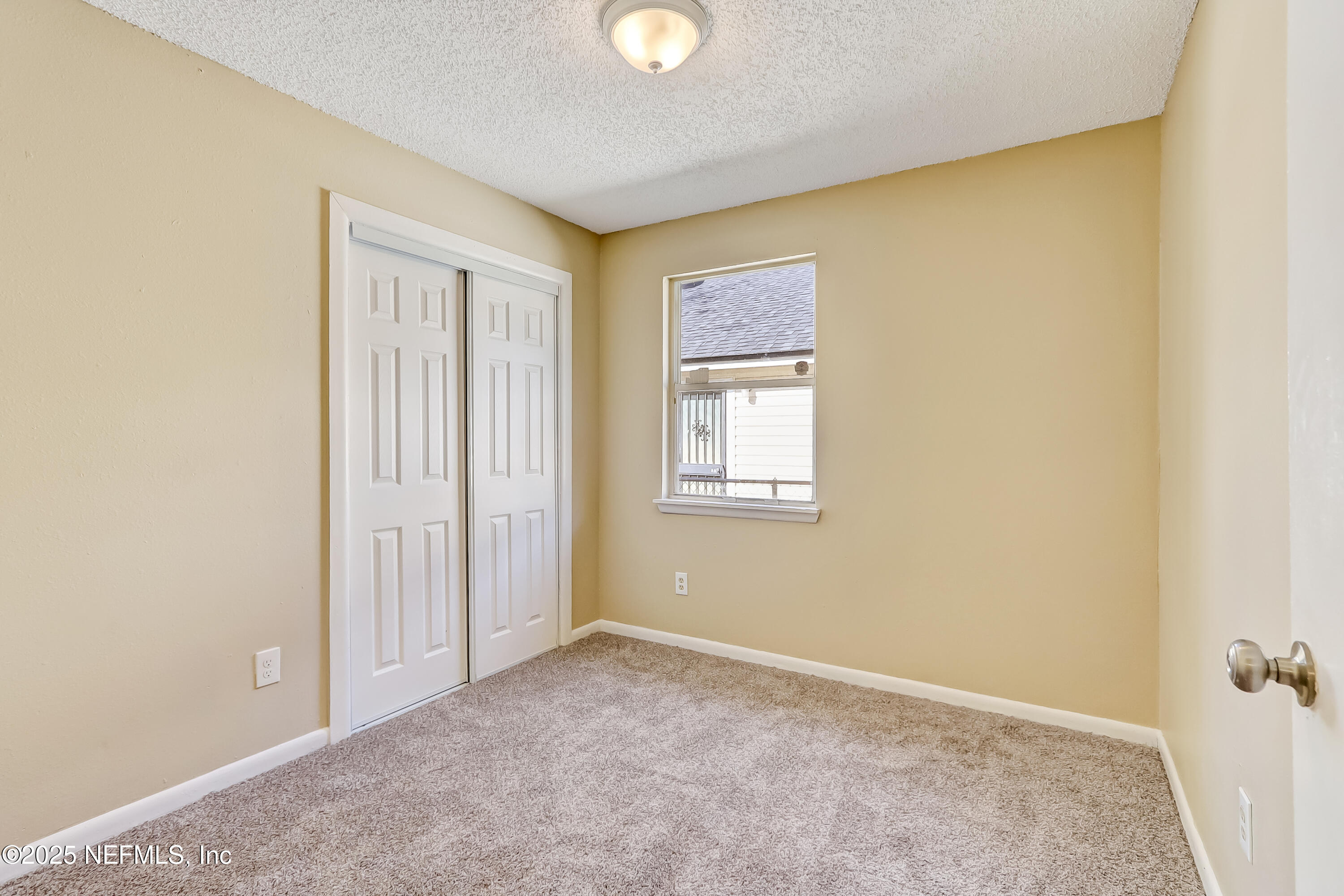 357 Smith Street Jacksonville, FL 32204 - Photo 16 of 26 a view of an empty room with a window