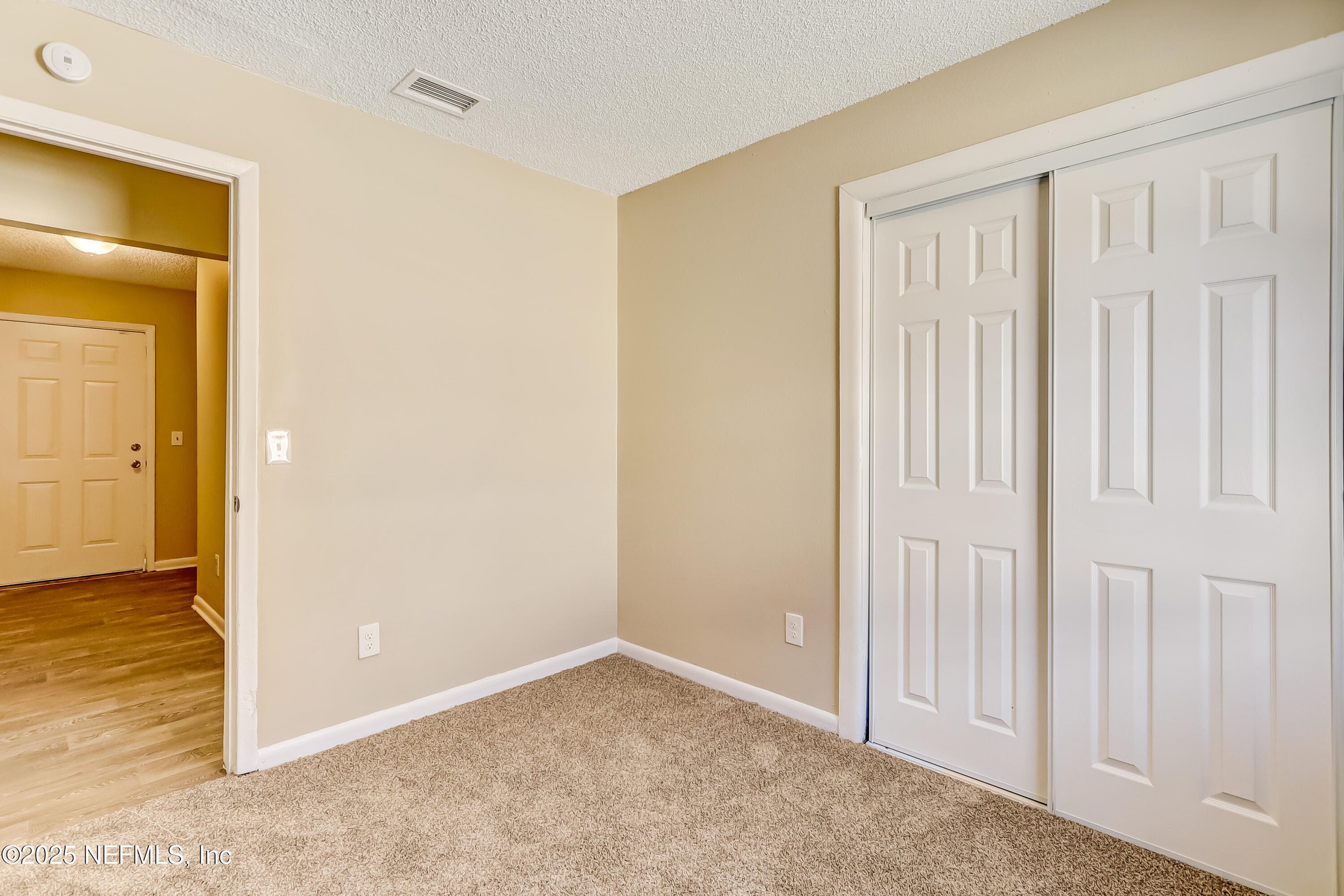 357 Smith Street Jacksonville, FL 32204 - Photo 17 of 26 an empty room with windows