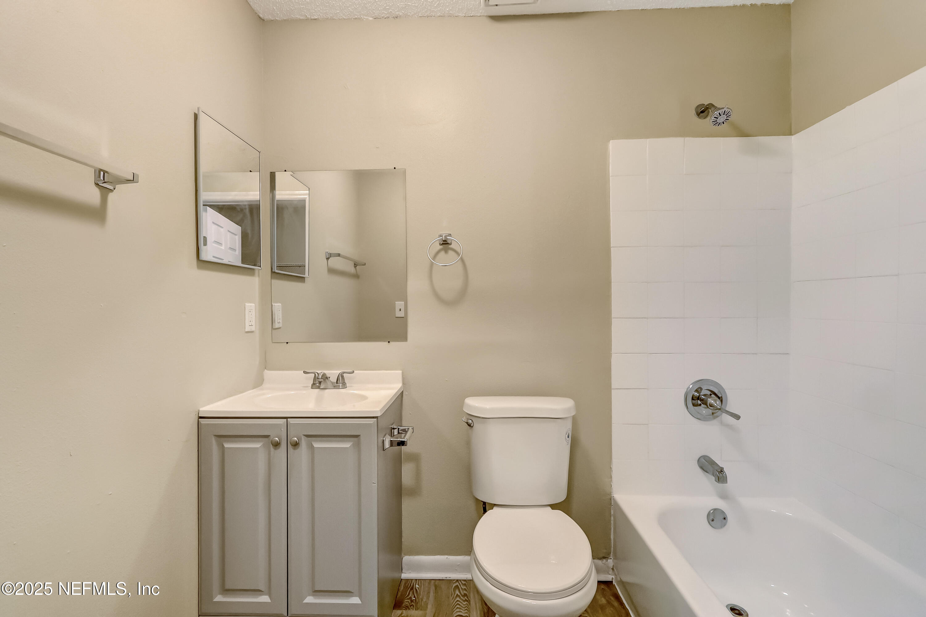 357 Smith Street Jacksonville, FL 32204 - Photo 18 of 26 a bathroom with a toilet a sink and bathtub
