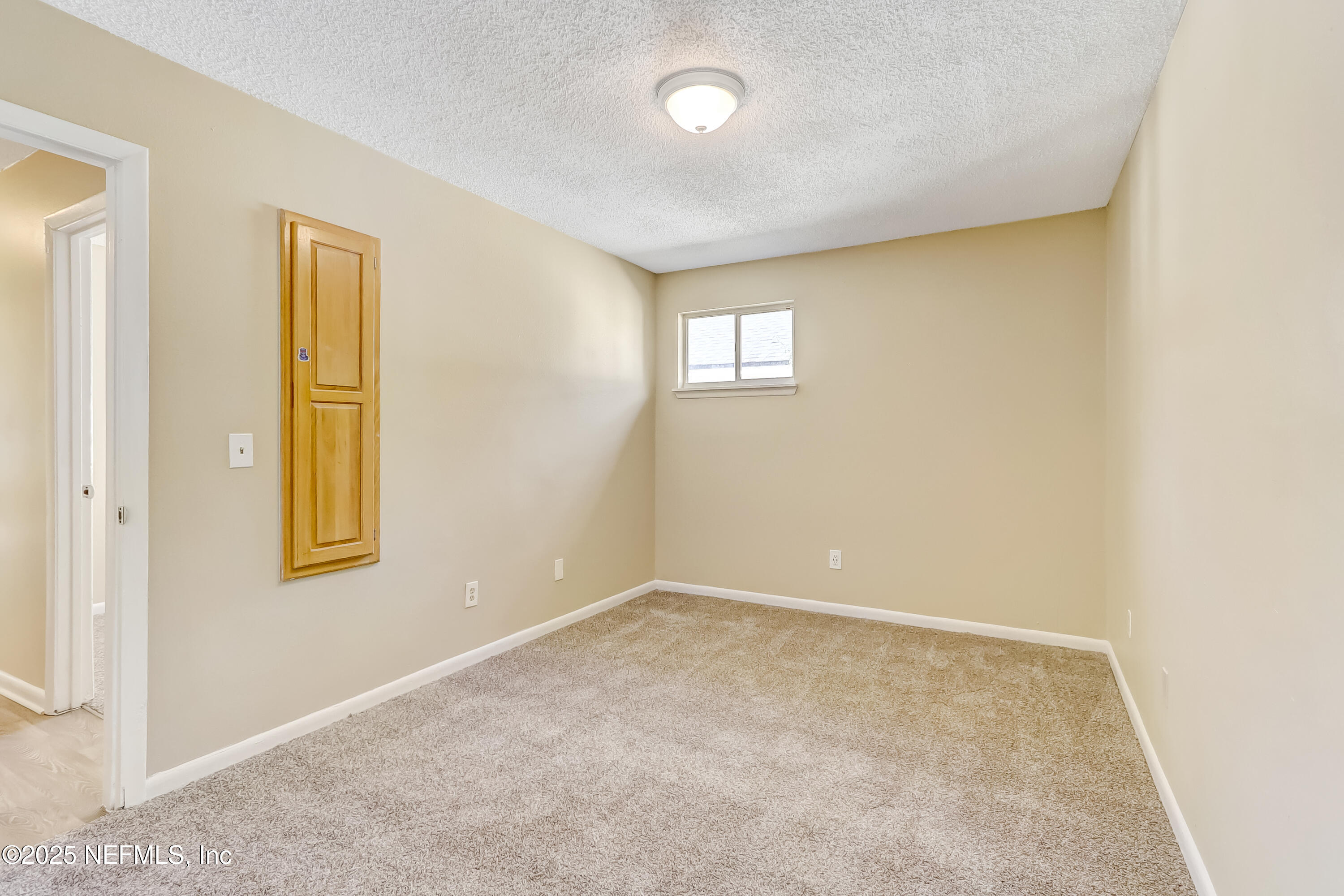 357 Smith Street Jacksonville, FL 32204 - Photo 23 of 26 an empty room with windows and closet