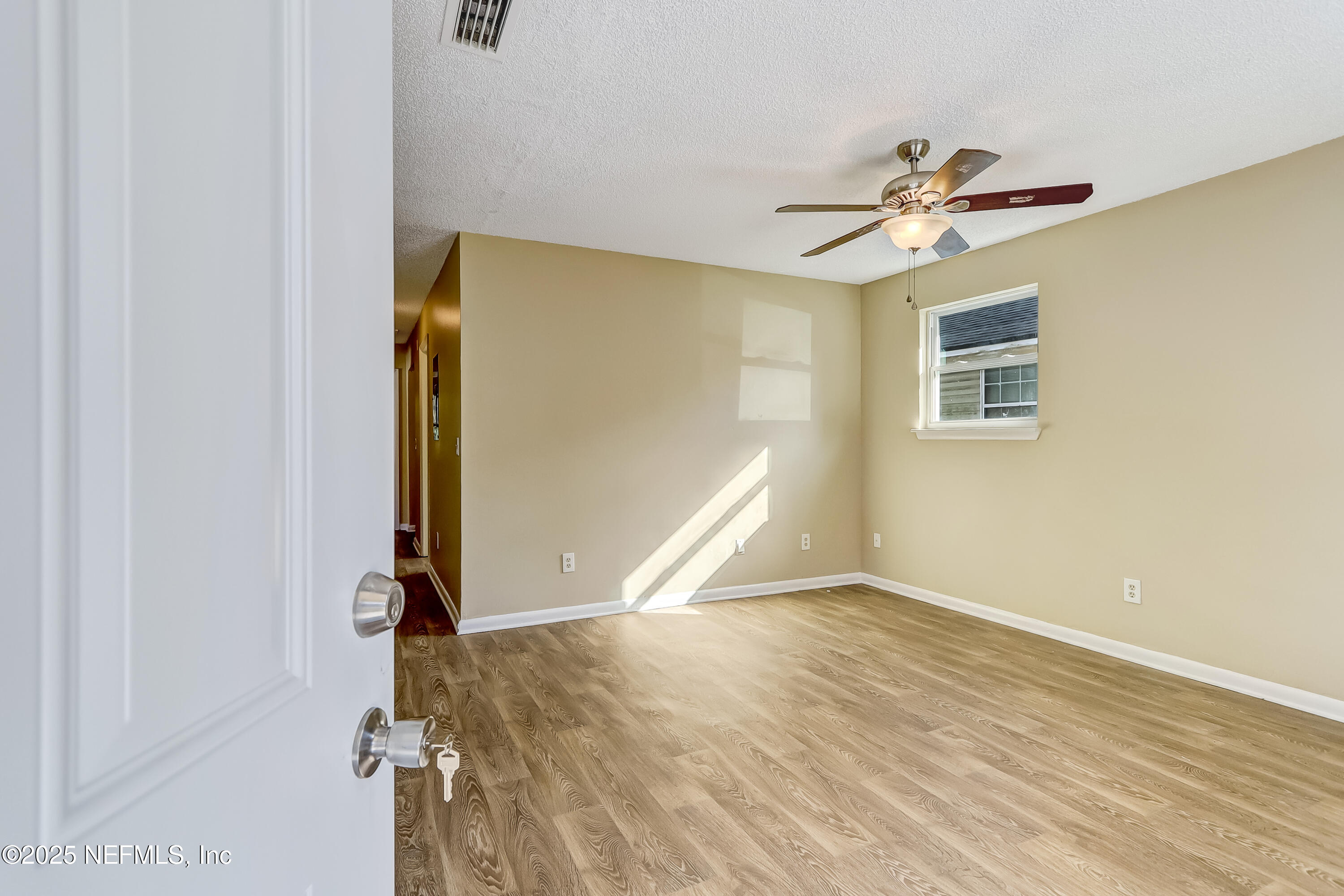 357 Smith Street Jacksonville, FL 32204 - Photo 3 of 26 a view of a livingroom with a ceiling fan and window