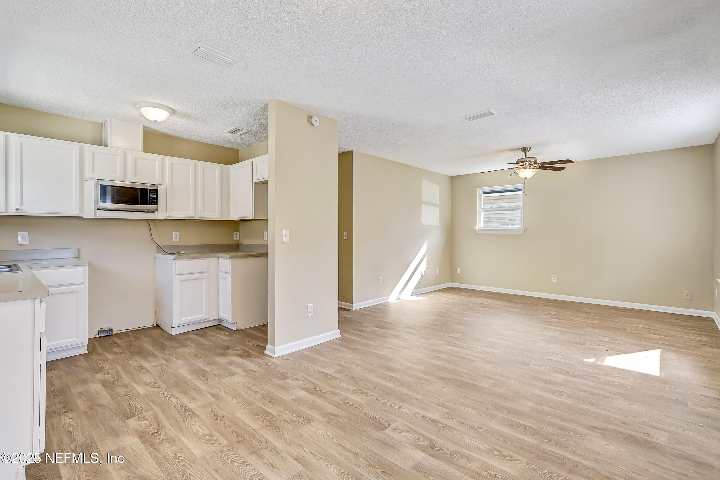 357 Smith Street Jacksonville, FL 32204 - Photo 6 of 26 a view of a kitchen with a stove cabinets and wooden floor